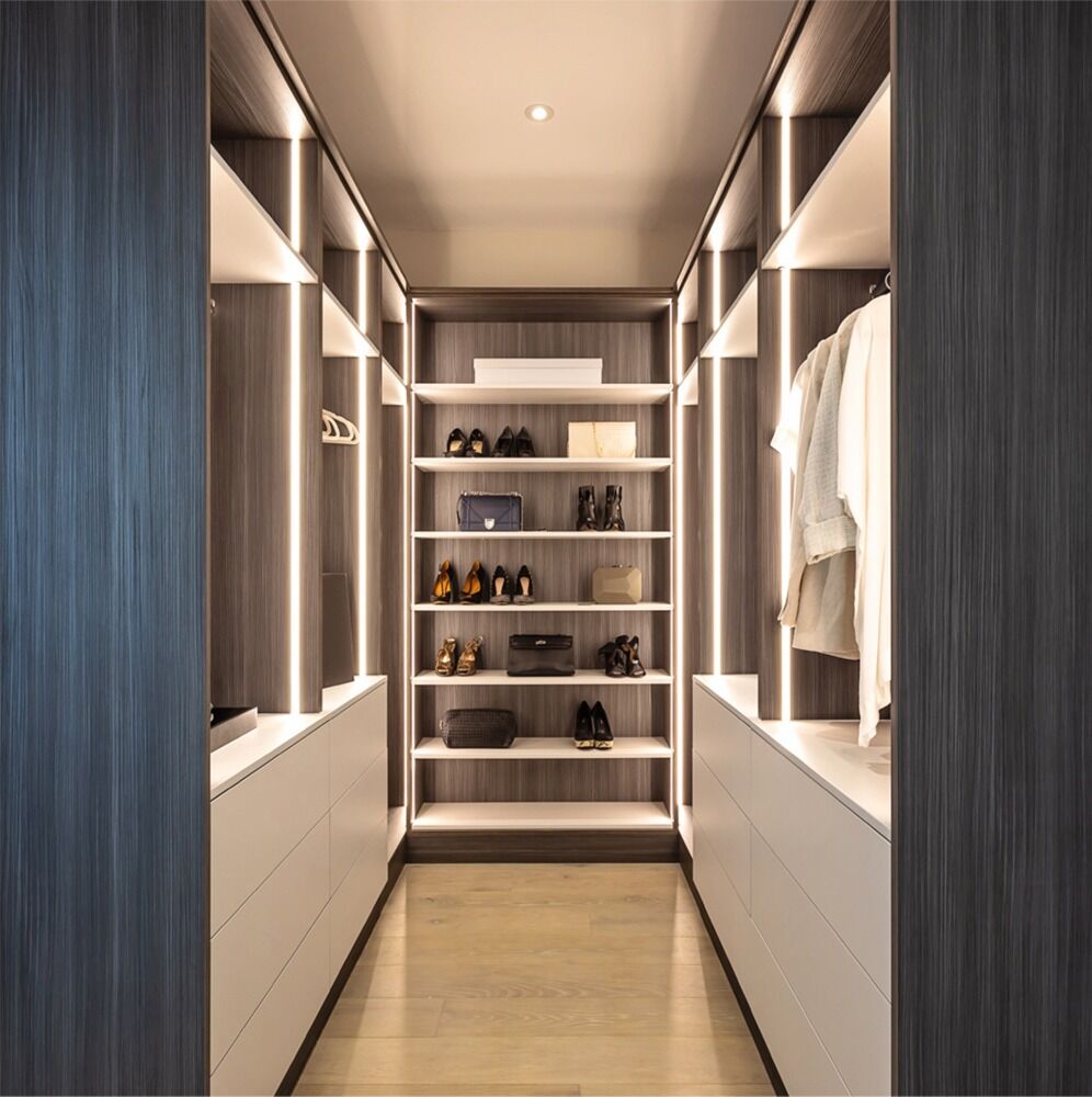 Made to measure his and hers walk in wardrobe: residential interior design by Studio G for a New England style home in Surrey