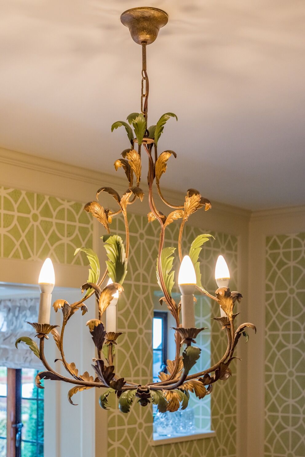 Statement dining room chandelier: residential interior design by Studio G for a English country style home in Cobham, Surrey